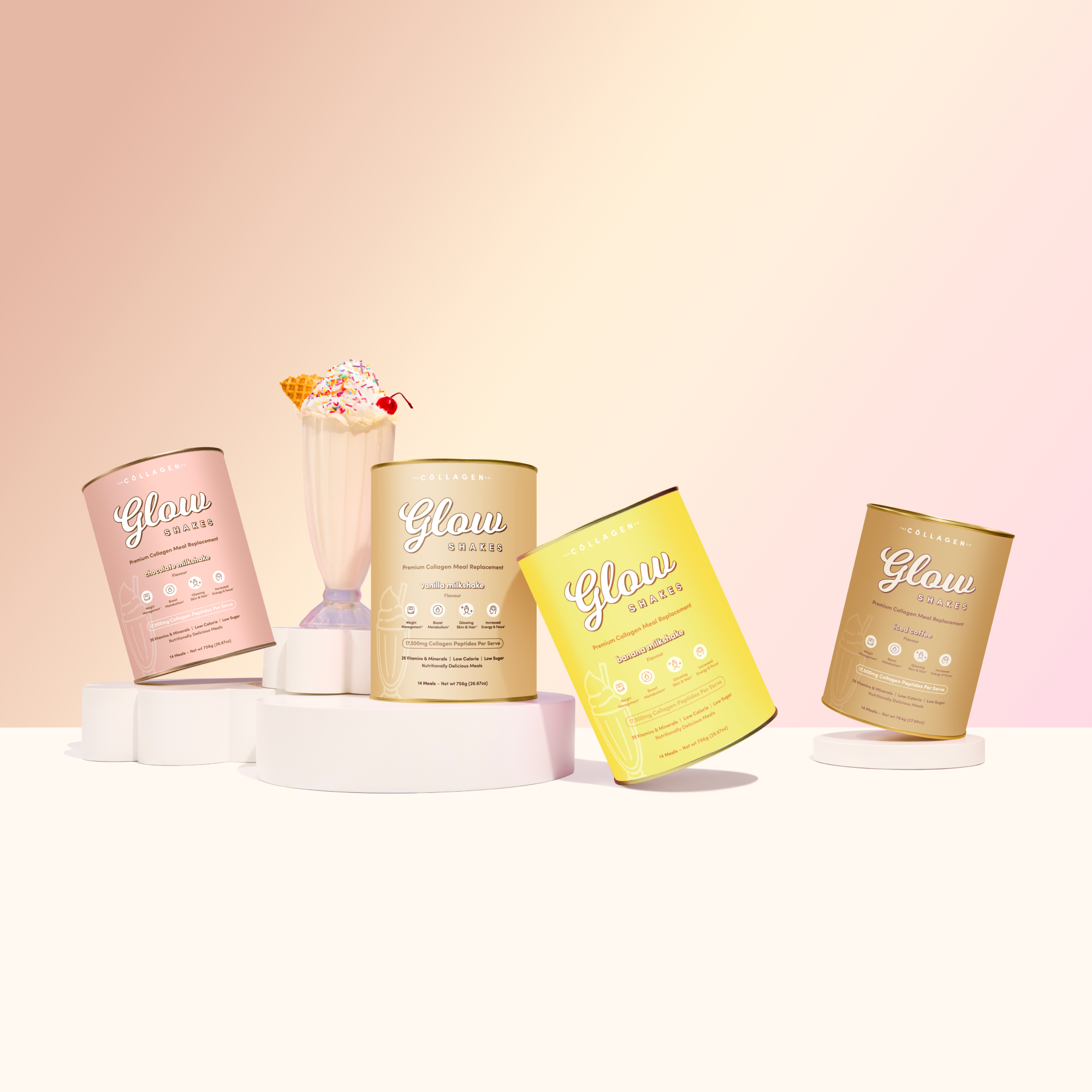 Glow Shake cans in chocolate, vanilla, banana, and iced coffee flavors are arranged in a semicircle around a vanilla milkshake topped with rainbow sprinkles and a waffle cone