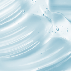 Close-up of a light blue gel texture with smooth swirls and small air bubbles, representing a skin care or collagen beauty supplement product.