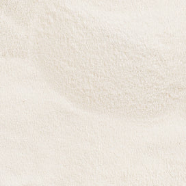Close-up of fine, white collagen powder texture, ideal for beauty supplements and skincare.