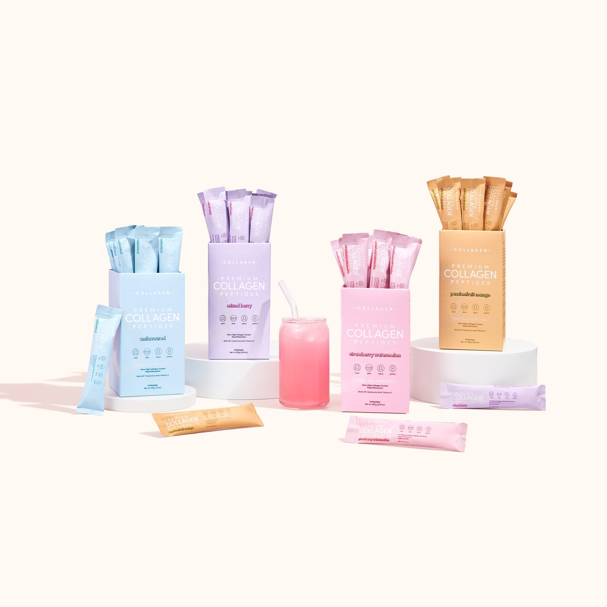Custom Glow Getter Bundle collagen peptide sachets in pastel blue, purple, pink and orange with refreshing drink display