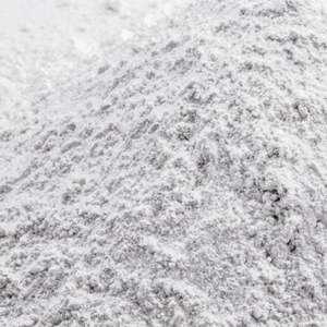 Close-up of a textured white collagen powder pile, highlighting its fine granules. Ideal for beauty and wellness supplements.