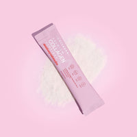 Mixed Flavours Collagen Sachets packet on pink background with white powder scatter effect