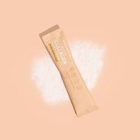 Mixed Flavours Collagen Sachet on peach background with white powder splash effect showing product packaging