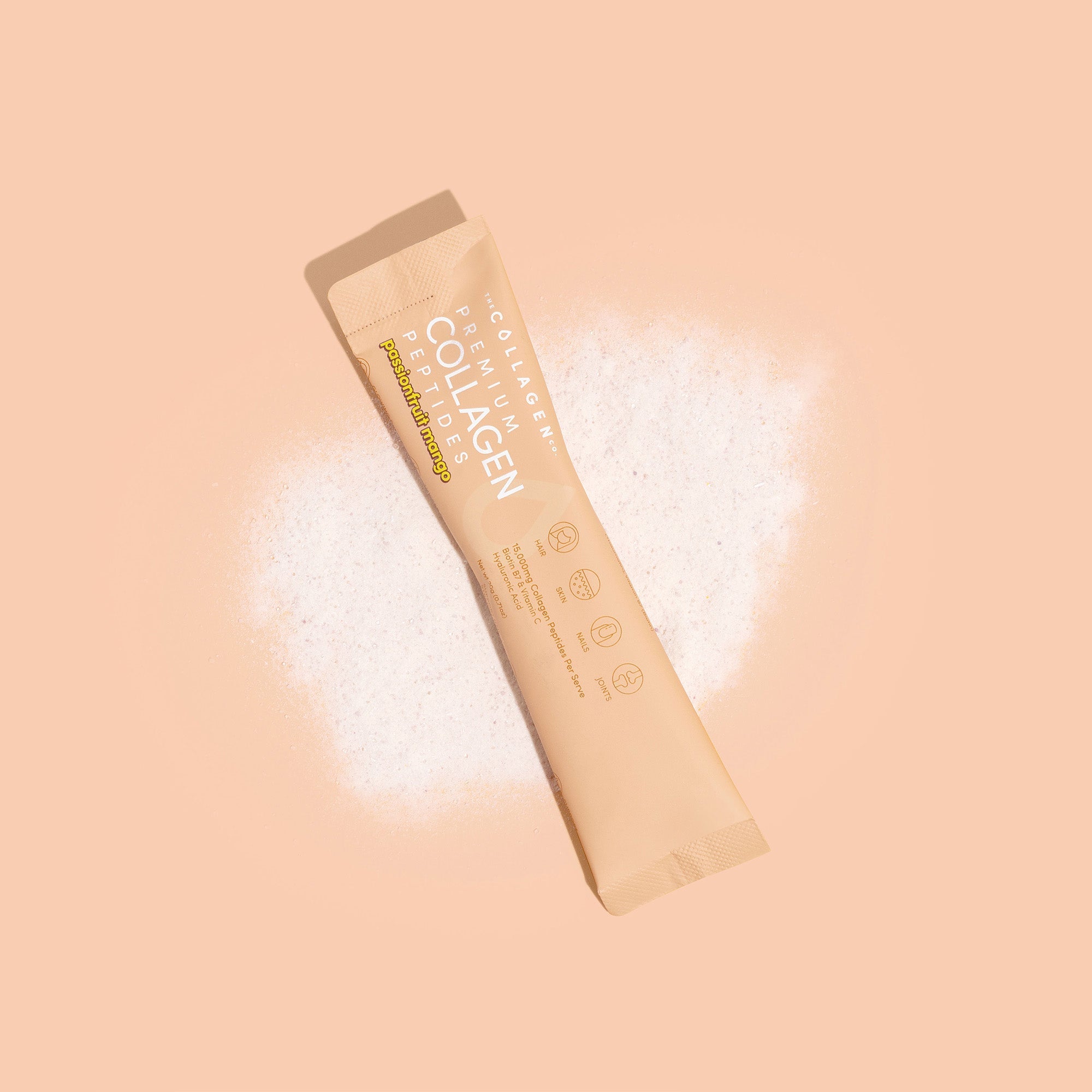 Mixed Flavours Collagen Sachet on peach background with white powder splash effect showing product packaging