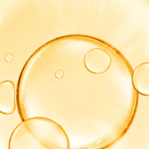 Golden translucent collagen bubbles on a radiant background, highlighting beauty supplements and skincare vitality.
