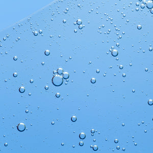 Clear blue gel texture with scattered bubbles; highlights skincare and beauty supplement themes.