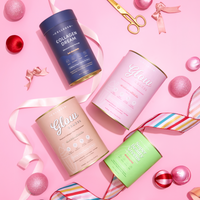 The Collagen Co.’s 2026 Reset Bundle features pastel supplement containers arranged on a pink background with ribbons, scissors, and ornaments, creating a festive vibe.