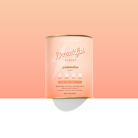 Canister of 'Beautiful Energy' peach iced tea on a peach background