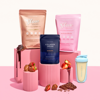 Collagen supplement pouches and shaker with strawberries, chocolate, and pink decor on a pink background, promoting beauty and wellness.