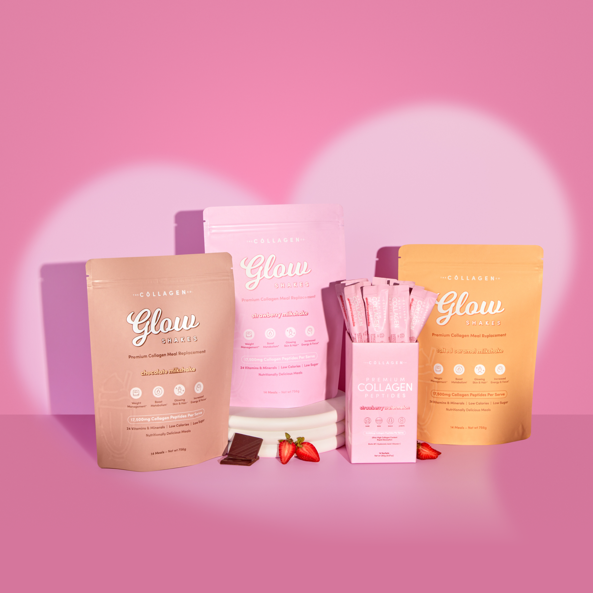 Collagen supplement products in pastel packaging on a pink background, with strawberries and chocolate accents.