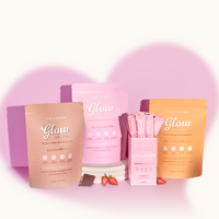 Collagen supplements displayed with pink packaging, labeled "Glow," surrounded by strawberries on a soft pink background.