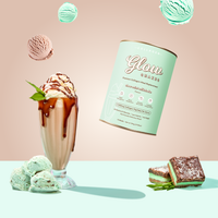 A Choc-Mint Collagen Meal Replacement by The Collagen Co. with whipped cream and mint leaves sits beside mint ice cream scoops and dessert bars, while other scoops and the product canister float above.