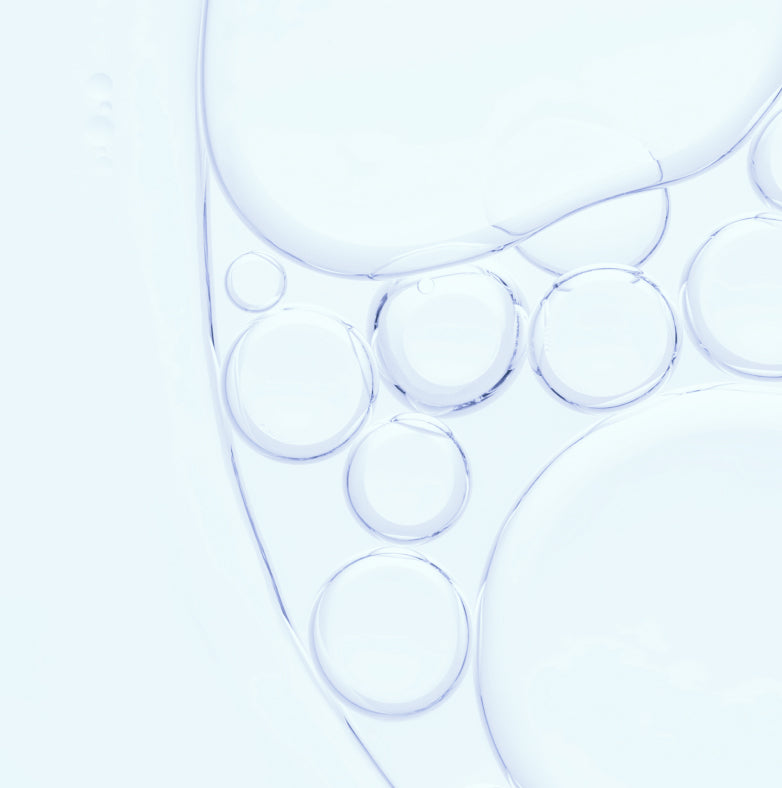 Translucent, overlapping bubbles of various sizes on a pale blue background, creating an abstract and minimalistic pattern reminiscent of oil or water droplets.