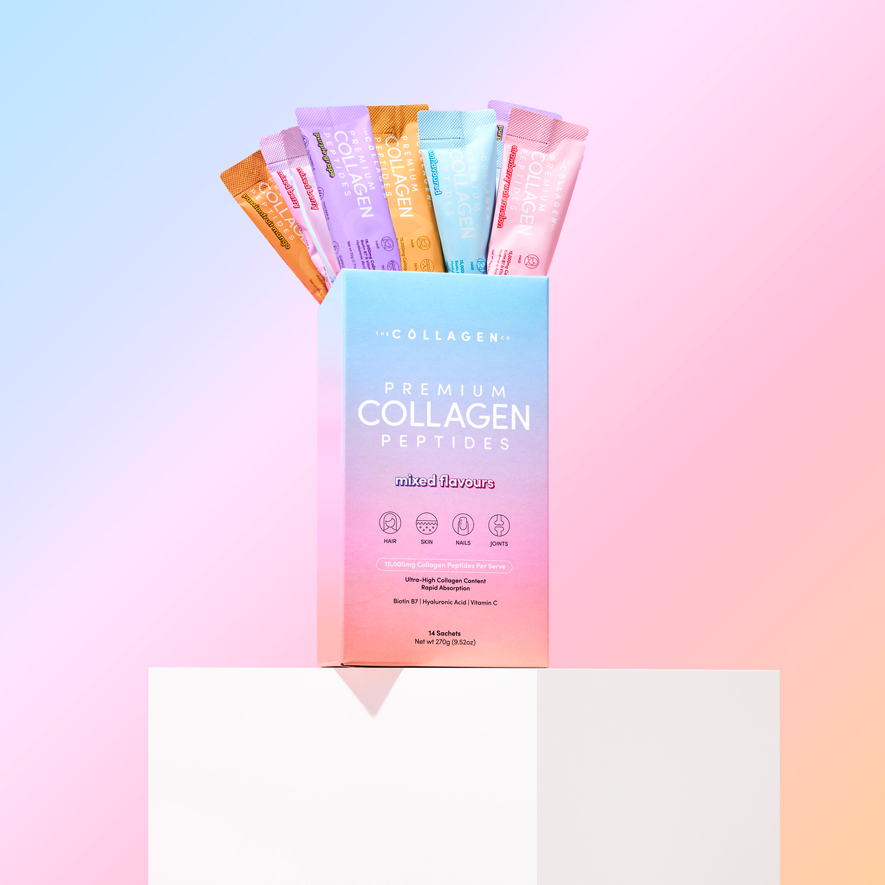 Box of mixed flavor collagen peptide sticks on gradient pastel background, featuring assorted packets for beauty and wellness supplements.