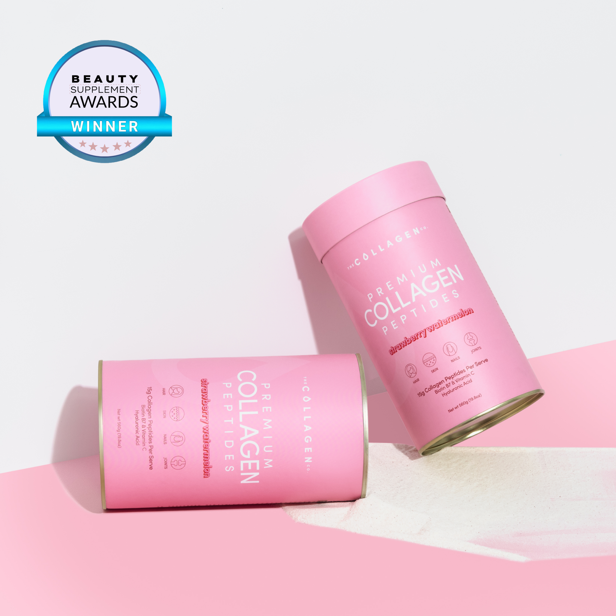 Two pink containers of premium collagen peptides on a pink surface, with a beauty supplement award badge in the top left corner.