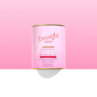 A pink container of The Collagen Co USA’s Strawberry Kiwi Beautiful Energy (280g) collagen protein drink mix, labeled in white and gold, is set against a light pink and white background.