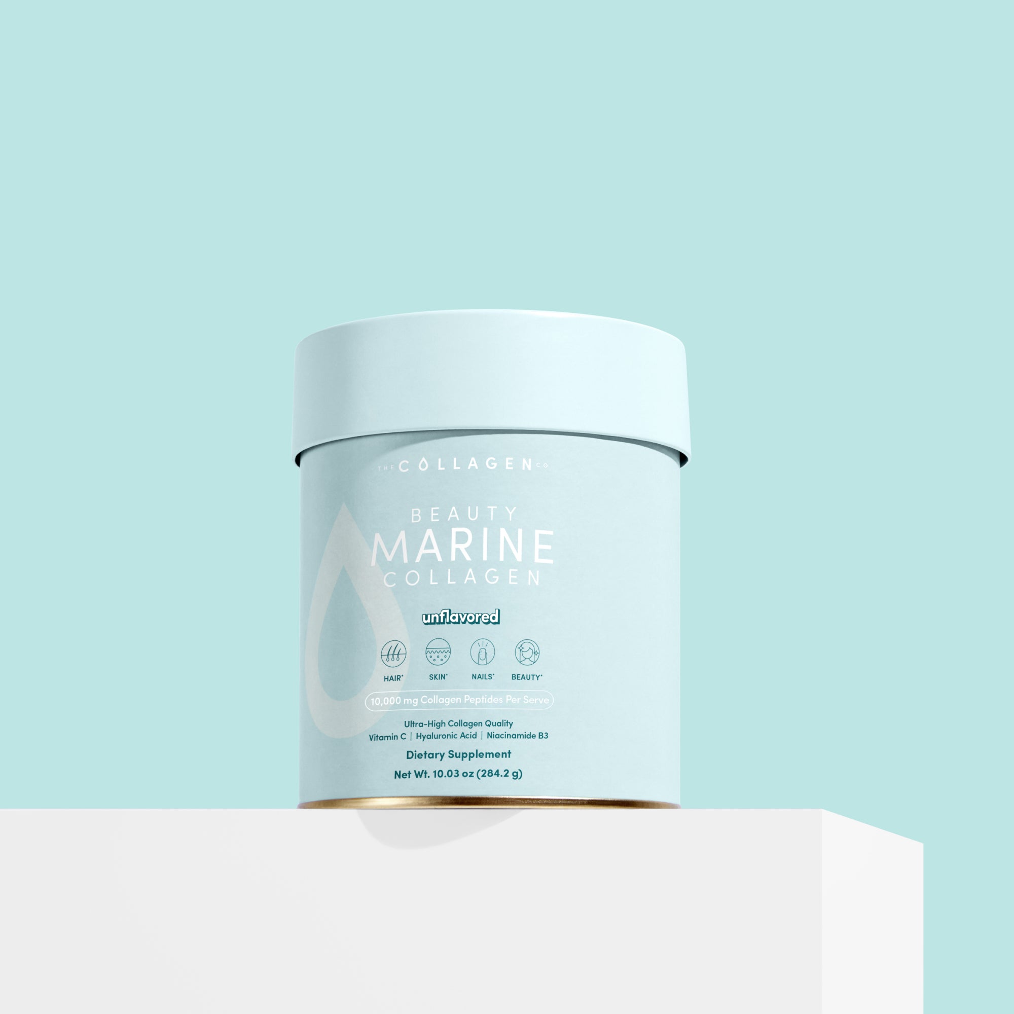 A light blue container of The Collagen Co. Unflavored Beauty Marine Collagen Powder (284g) sits on a white surface against a light blue background, featuring its hydrolysed marine collagen and key ingredient and benefit details on the label.