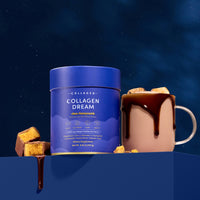 A blue tub of The Collagen Co. Choc-Honeycomb Collagen Dream Advanced Sleep Formula Hot Chocolate (231g) sits next to a collagen-infused hot chocolate mug, chocolate dripping over the rim, with honeycomb pieces and a starry night sky backdrop.