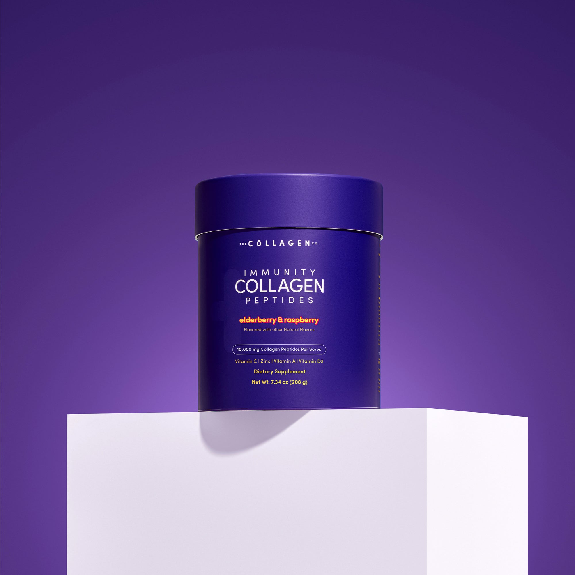 A purple container of The Collagen Co. Immunity Collagen Peptides - Elderberry & Raspberry 208g sits on a white pedestal against a purple background, highlighting its immune-supporting benefits and berry flavors.