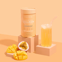 A 560g container of thecollagen.co Passionfruit Mango Collagen Powder sits beside a glass of iced juice, mango slices, and passion fruit, emphasizing its premium hydrolysed bovine collagen for anti-ageing benefits.