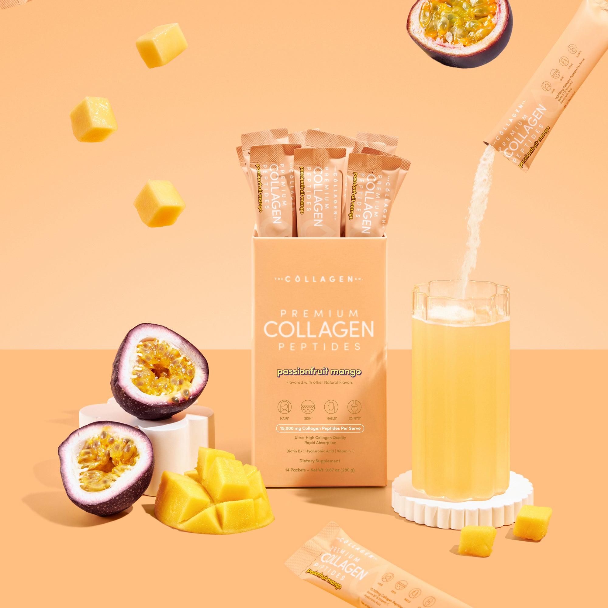 Thecollagen.co Passionfruit Mango Collagen Sachets (280g): single-serve sticks shown with powder pouring into a glass and fresh fruit on a pastel peach background—ideal for daily beauty and wellness routines.