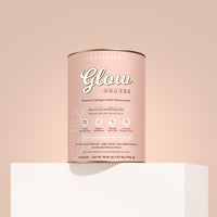 Collagen Glow Shakes container on a matching chocolate background