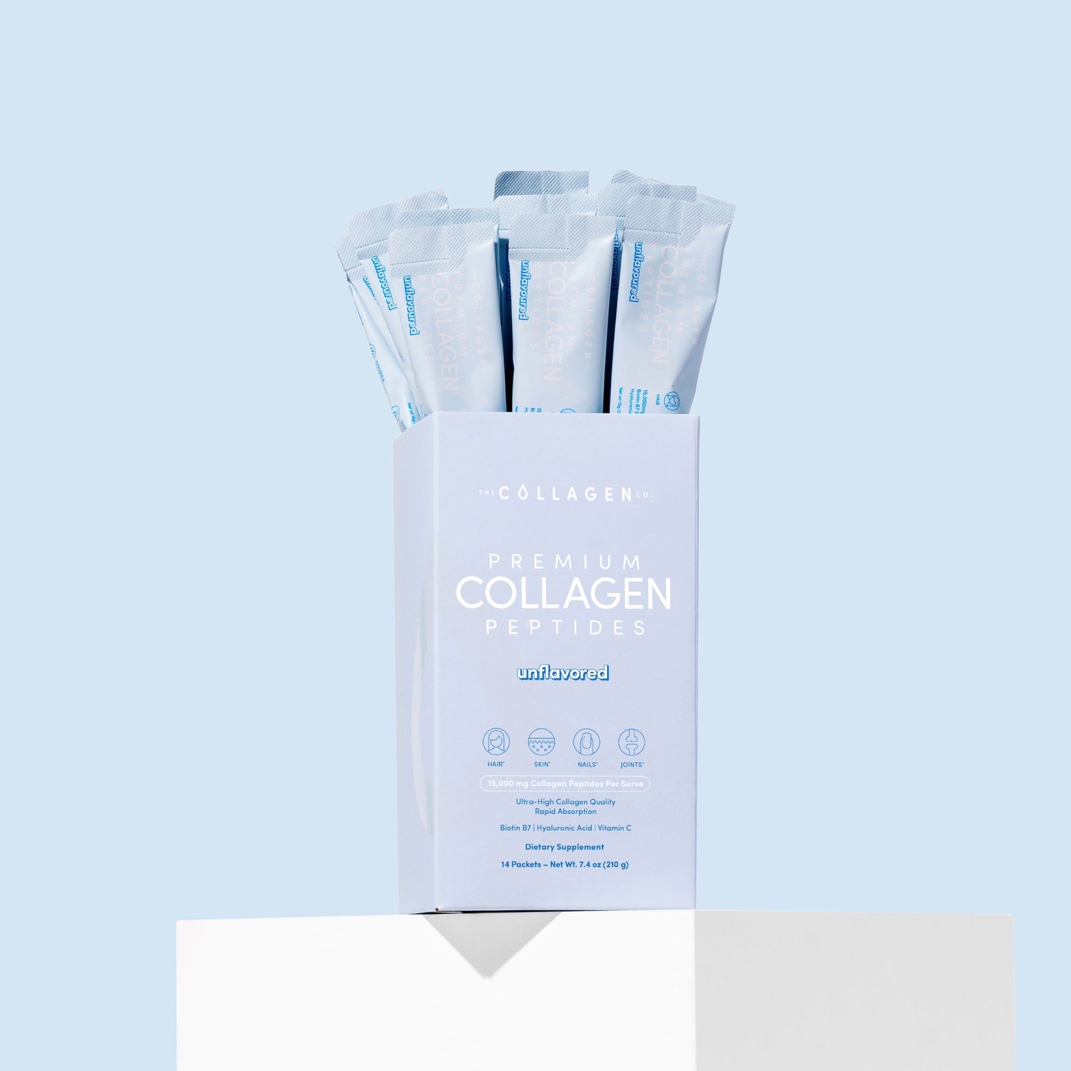 Box of premium collagen peptides with multiple packets on a light blue background