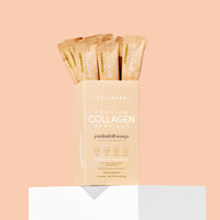 Box of premium collagen peptides with packets on a peach background
