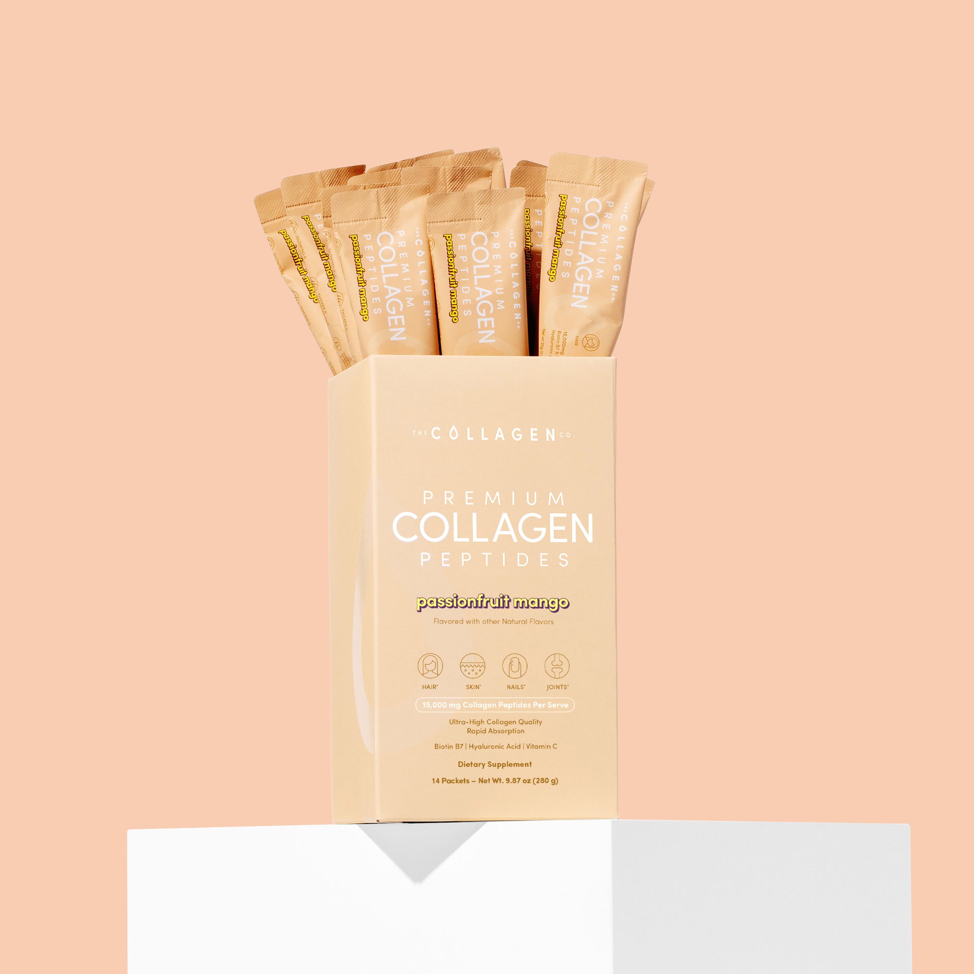 Box of premium collagen peptides with packets on a peach background