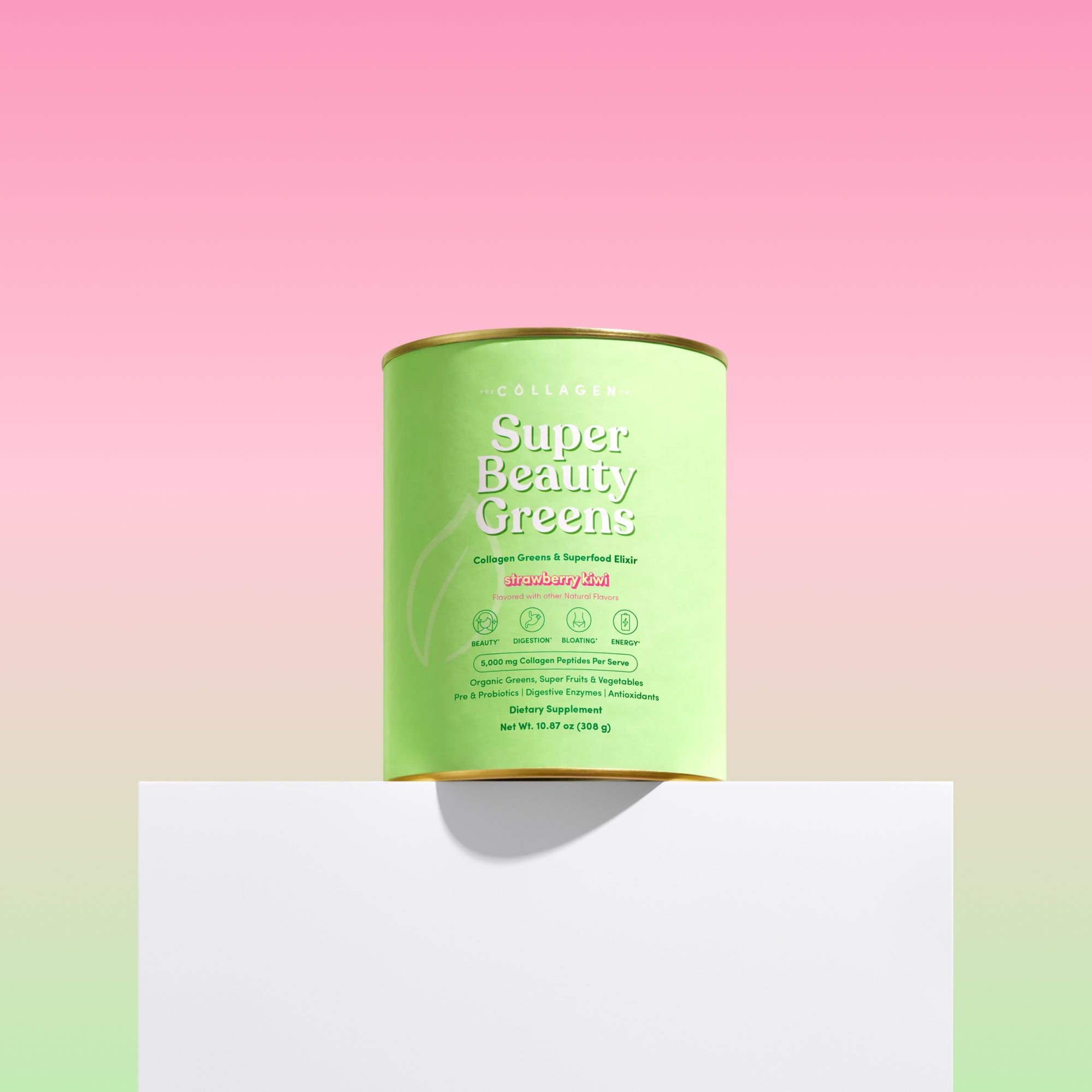 Green canister labeled 'Super Beauty Greens' on a gradient pink to white background