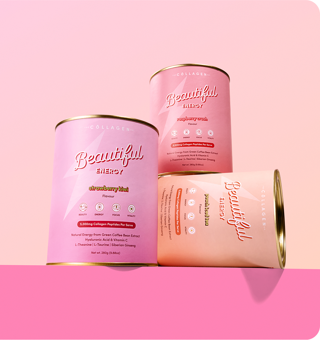 Three cylindrical cans of Beautiful Energy collagen drink powder in pink and peach hues are arranged against a pink gradient background. Each can displays the flavor and key ingredient icons on the label.