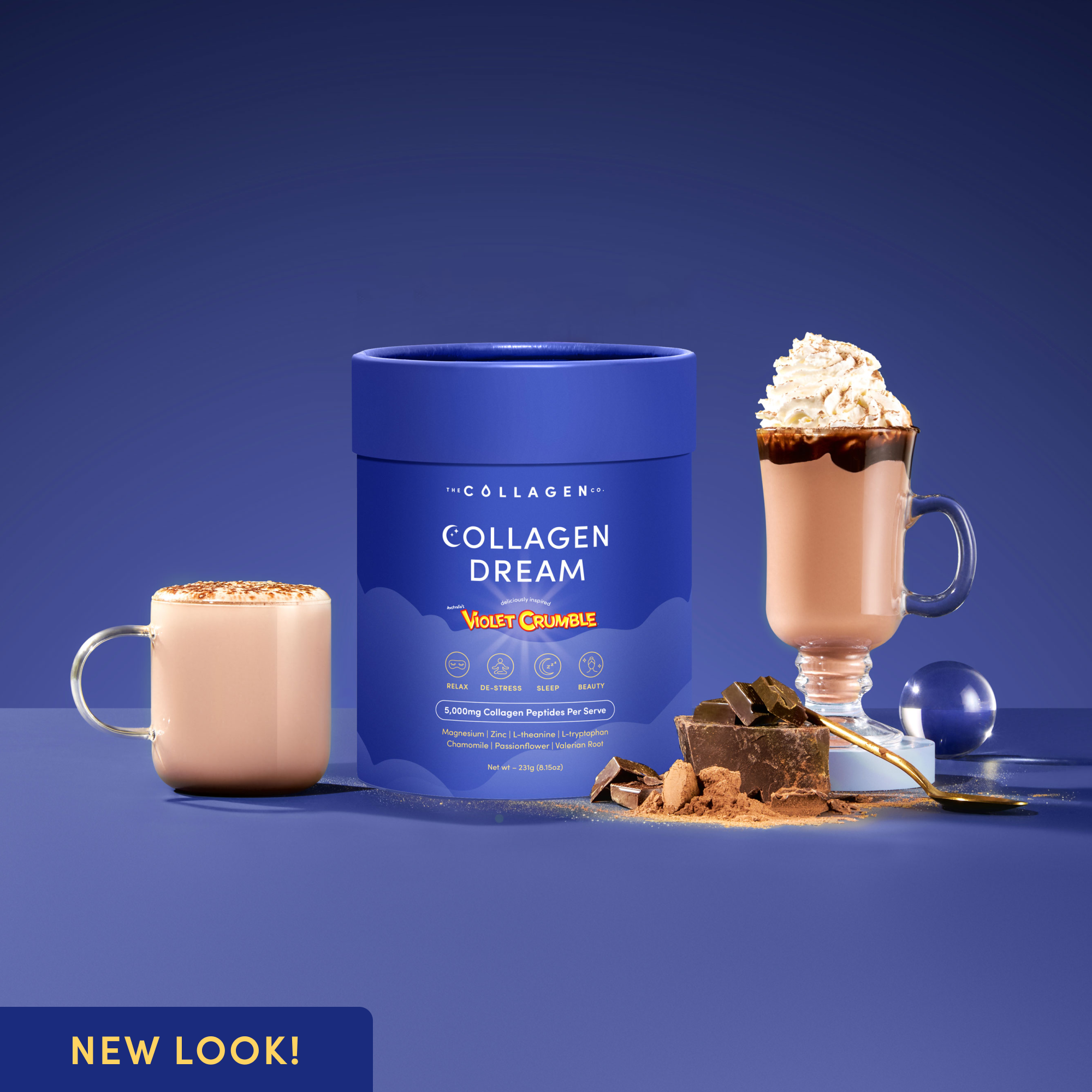 Collagen Dream Violet Crumble tub displayed with two prepared hot chocolate drinks, surrounded by chocolate pieces and powder, on a rich violet surface with a ‘New Look!’ badge.